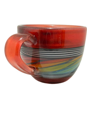 Colorful glass object with a red base on a white background